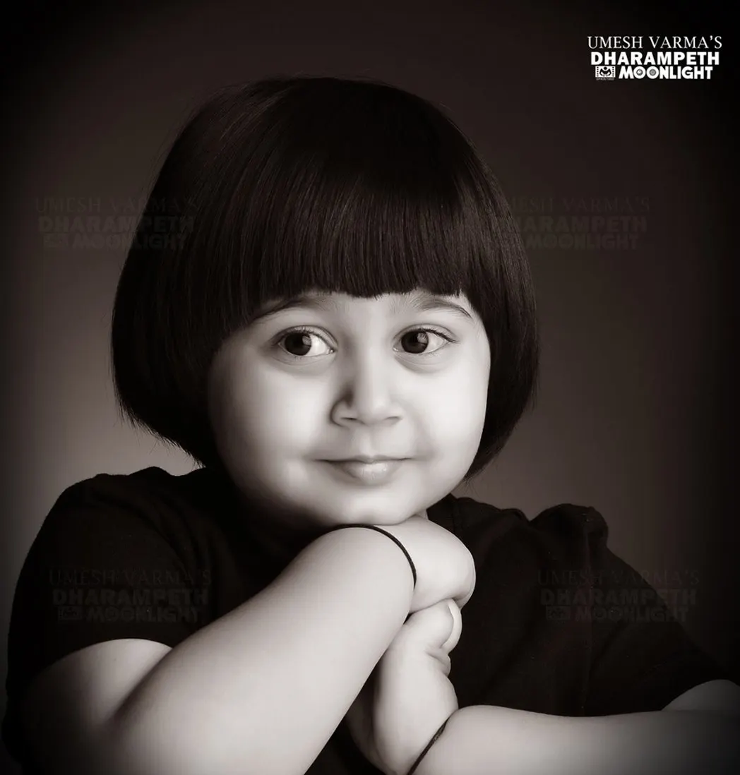 Black and white portrait of a child with a bob haircut