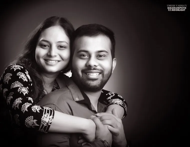 Black and white portrait of a couple embracing
