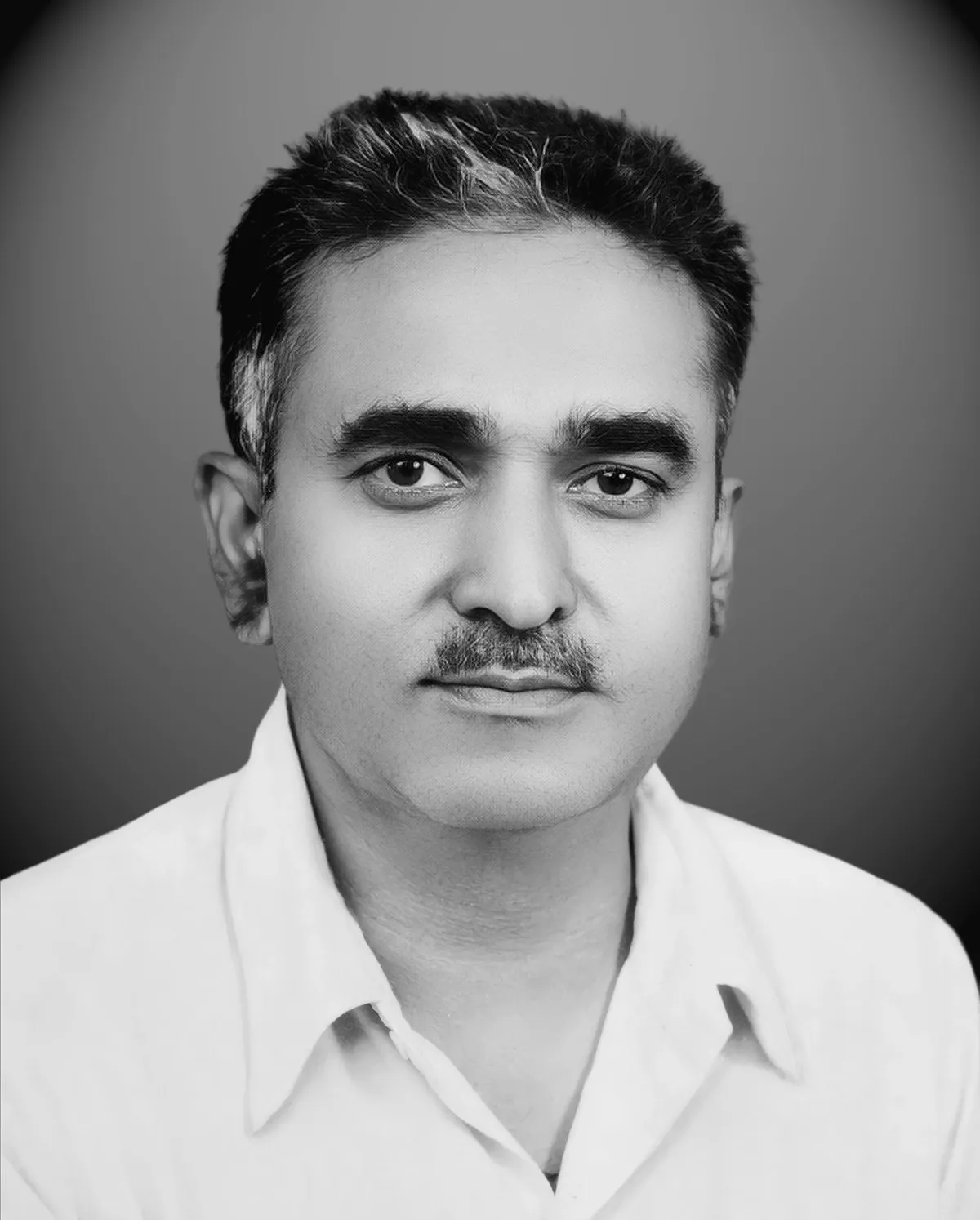 Black and white portrait of Late Shri Wasudeo Hiralal Varma, who founded Moonlight Studio in 1950