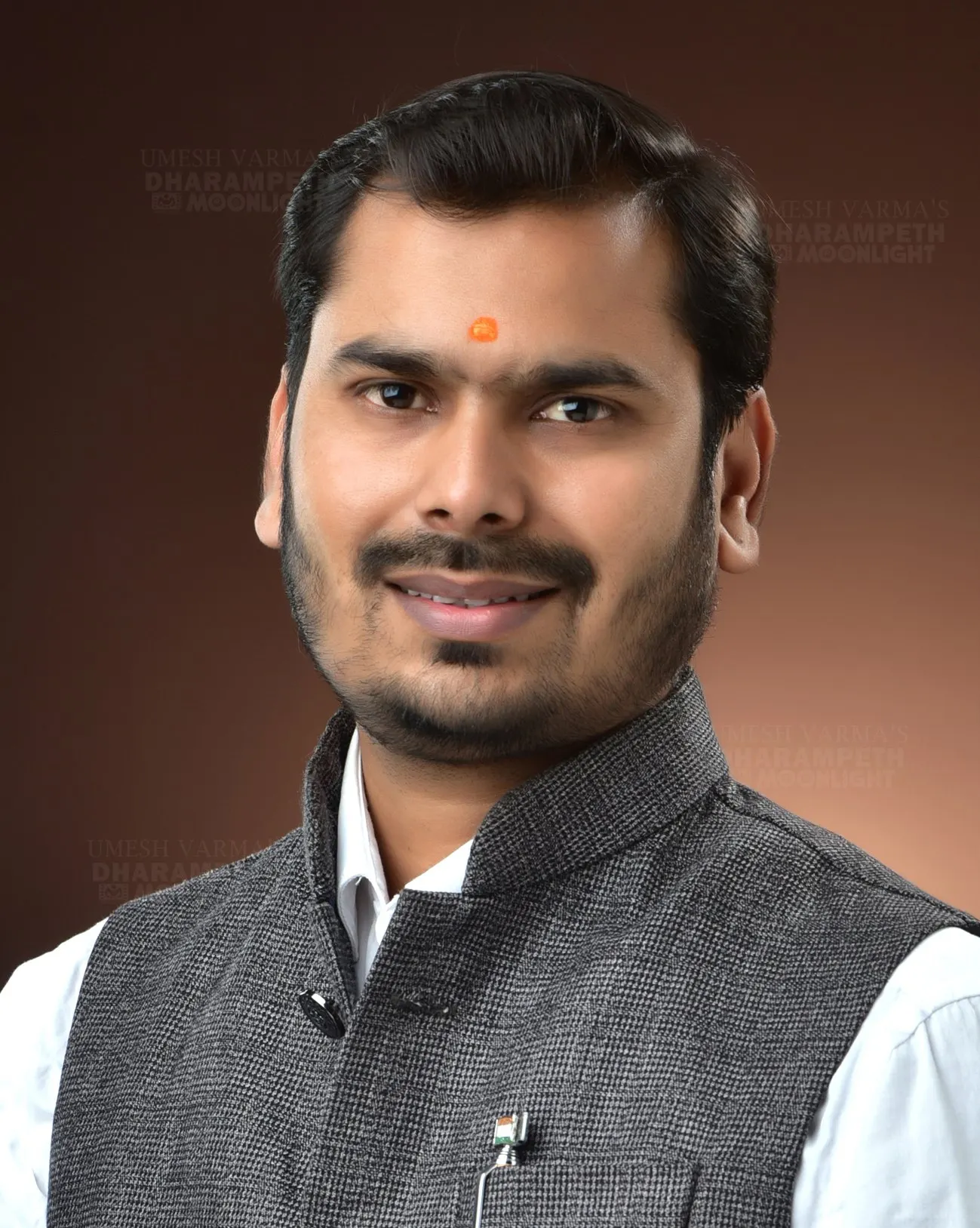 Portrait of a man in a grey Nehru jacket