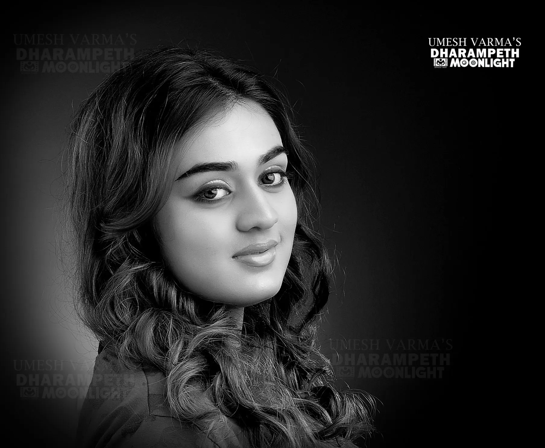 Black and white glamour portrait of a young woman